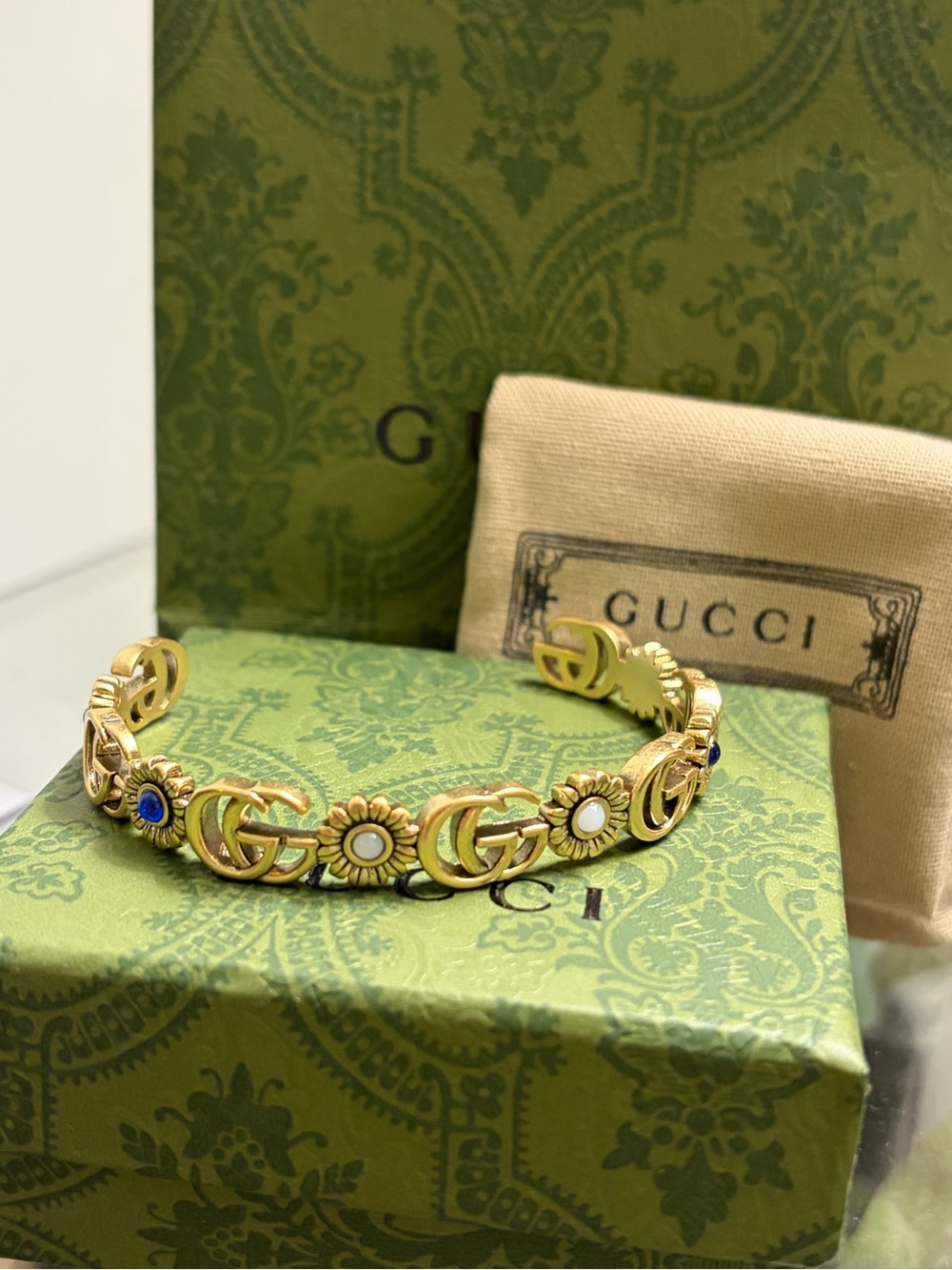 Gucci Gold-Tone Floral GG Bracelet with Blue & White Accents
